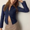 Getailleerd denim overhemd met dubbele ritssluiting Getailleerd denim overhemd met dubbele ritssluiting