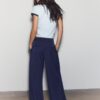 Getailleerde broek met Wide Leg pijpen en coupenaden Getailleerde broek met Wide Leg pijpen en coupenaden