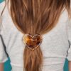 Hartvormige clip met studs