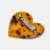 Hartvormige clip met studs
