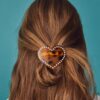 Hartvormige clip met studs