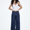 Jeans met lage taille en dubbele knoopsluiting Jeans met lage taille en dubbele knoopsluiting