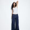 Jeans met lage taille en dubbele knoopsluiting Jeans met lage taille en dubbele knoopsluiting
