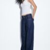 Jeans met lage taille en dubbele knoopsluiting Jeans met lage taille en dubbele knoopsluiting