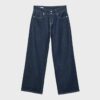 Jeans met lage taille en dubbele knoopsluiting Jeans met lage taille en dubbele knoopsluiting