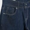 Jeans met lage taille en dubbele knoopsluiting Jeans met lage taille en dubbele knoopsluiting