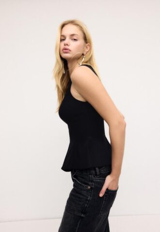 Mouwloze peplumtop