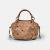 Ronde crossbodytas met oogjesdetail