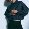 Soepelvallende, rechte broek met riem Soepelvallende, rechte broek met riem